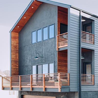 modern gray home with two balconies