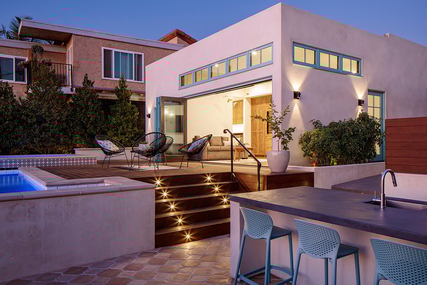 This remodel proves that adding livable square footage to an existing home doesn’t always mean expanding the footprint. Here, an Andersen Folding Outswing Door opens up entirely new spaces for indoor/outdoor living within the home’s existing footprint. 