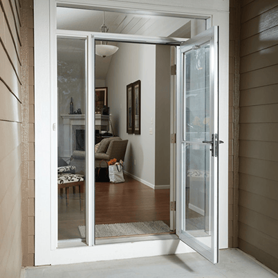 front entrance of home with white andersen storm door open